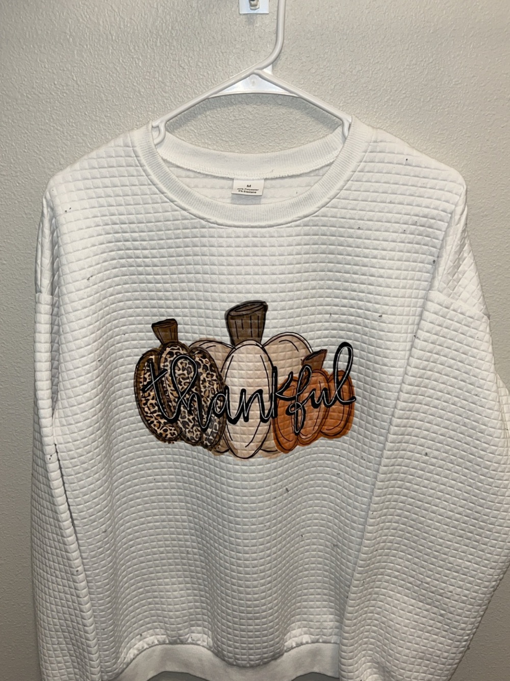 White Quilted Crewneck Sweatshirt with Thankful Pumpkin Graphic